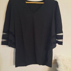 Medium black blouse. Lightweight with sheer design on sleeves.